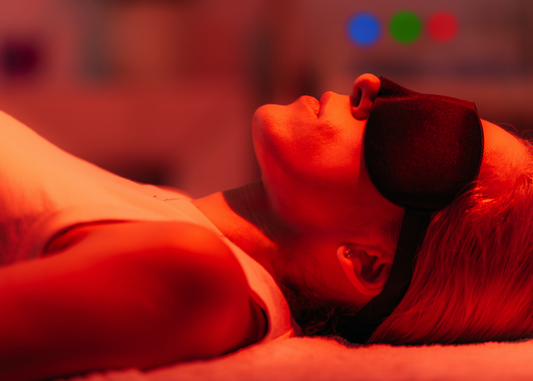 Woman lying down having Red Light Therapy Woman lying down having Red Light Therapy